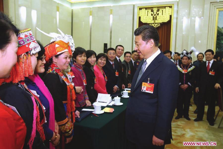 Xinhua/Lan Hongguang Chinese President Xi Jingping greets deputies to the National People s Congress from Guangxi Zhuan Autonomous Region, March 8.