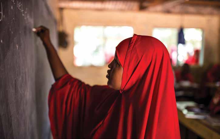 Photo: Girl responds to question in remedial class in Dadaab camp.