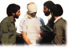 C31-23P partial KO clone out hand Iranians present a blindfolded and handcuffed American hostage.