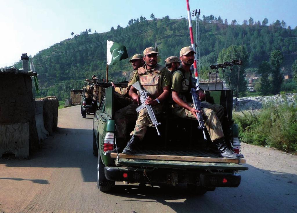 Pakistan army soldiers patrol on a road in Matta in Pakistan s troubled Swat Valley. Photo courtesy of AP Photo/Abadullah Khan.