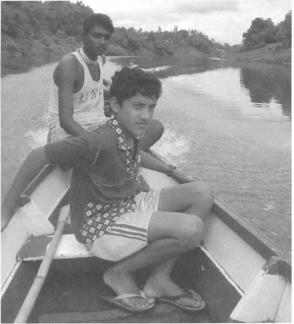 NIGHTMARE SPREADS 183 Boat boys on the Rewa River as Inda-Fijian villages suffered looting. Michael Field Kasanita Natoga came to be with Romika.