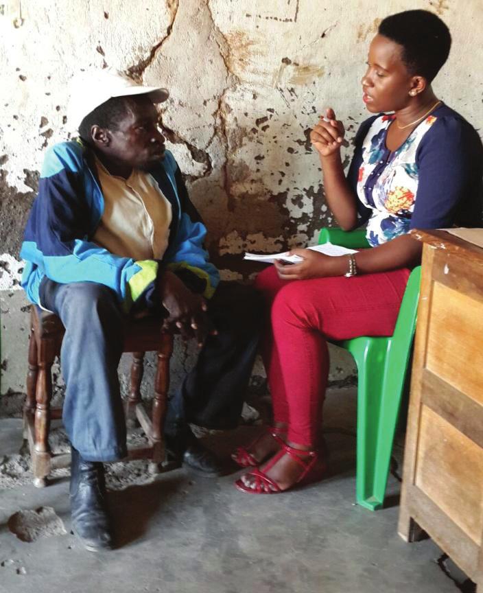 A NEC Officer interviewing one of the respondents in Nyasura Ward, Bunda Urban Mara.
