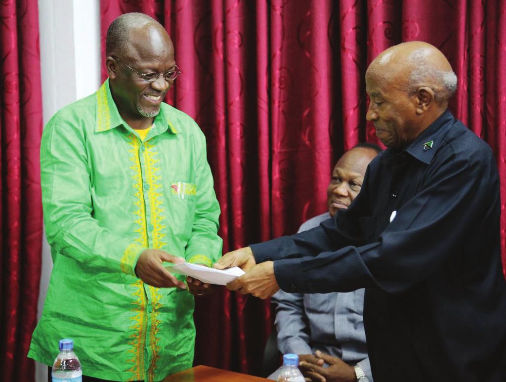 NEC Chairman, Hon. Justice (Rtd.) Damian Z. Lubuva (Right), receiving nomination forms from CCM Presidential Candidate Dr.