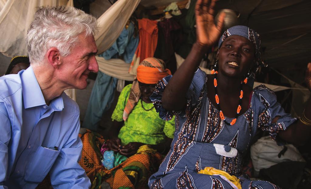 The new Under-Secretary-General for Humanitarian Affairs and Emergency Relief Coordinator, Mark Lowcock, speaks with displaced women at Wege Camp in Pulka, north-east Nigeria.