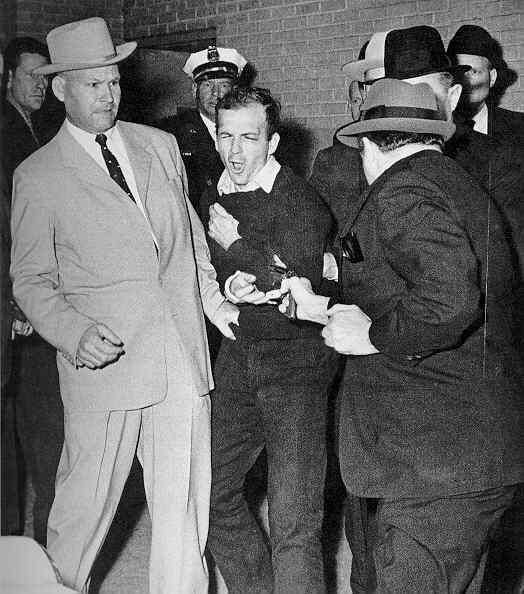 LEE HARVEY OSWALD CHARGED; SHOT TO DEATH A 24-year-old Marine with a suspicious past left a palm print on the rifle used to kill JFK He was charged and a national audience