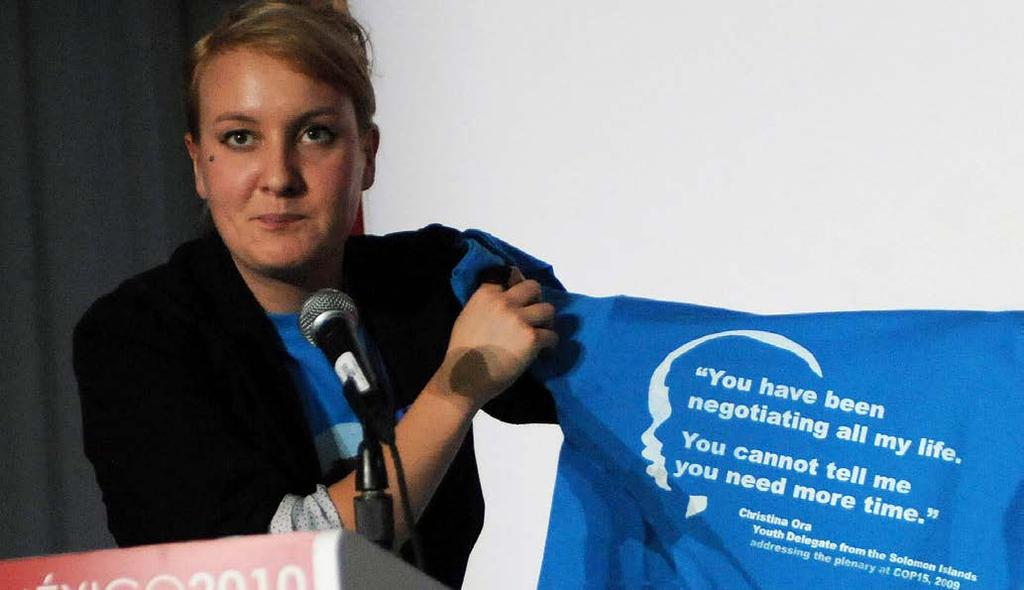FROM BALI TO MARRAKECH: A DECADE OF INTERNATIONAL CLIMATE NEGOTIATIONS At COP16 in Cancun, youth delegate Hilary Bowman holds up a t-shirt that says You have been negotiating all my life.
