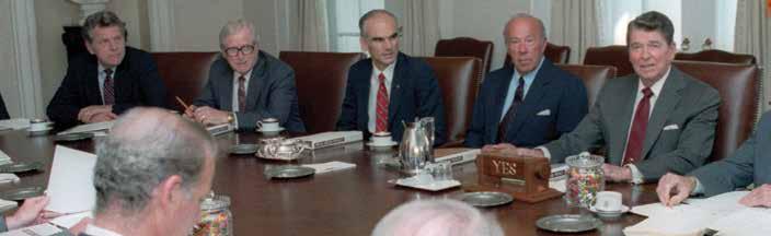 advises the President President Ronald Reagan leads a Cabinet meeting at the White