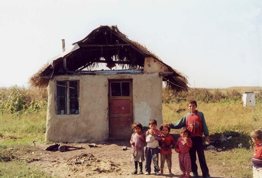 6. Roma in Ogra A growing community, increasing needs Picture: Children standing in front of their house in the Roma quarter.