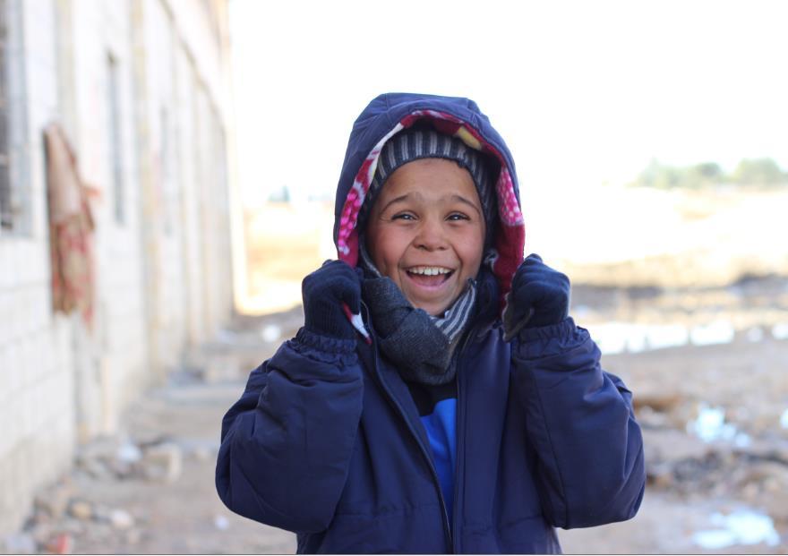 /UN044437/Al-Issa On 12 December 2016, Ahmed gives a radiant smile as he finds out that the clothes he was given were exactly his size.