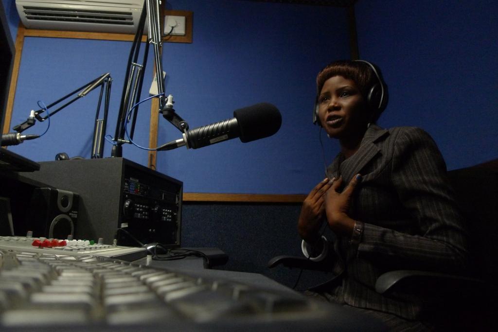 Mayardit FM reporter Christine Akuol in the studio.