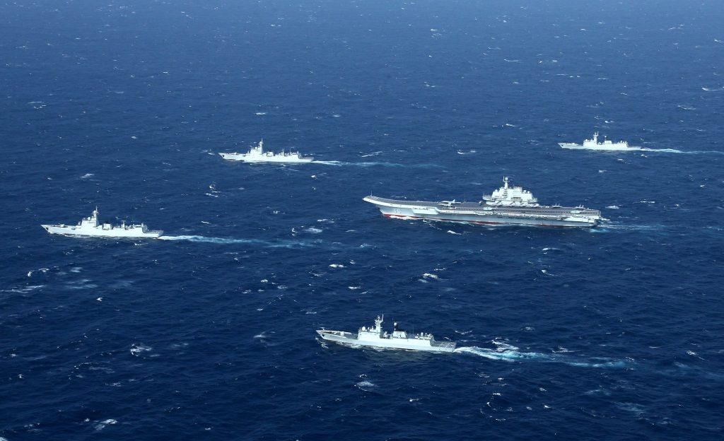 A Jan. 2, 2017 photo shows a Chinese navy formation, including the aircraft carrier Liaoning, center, during military drills in the South China Sea.