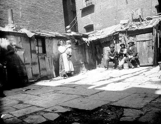 In the Tenements *Many immigrants lived in crowded tenement buildings.