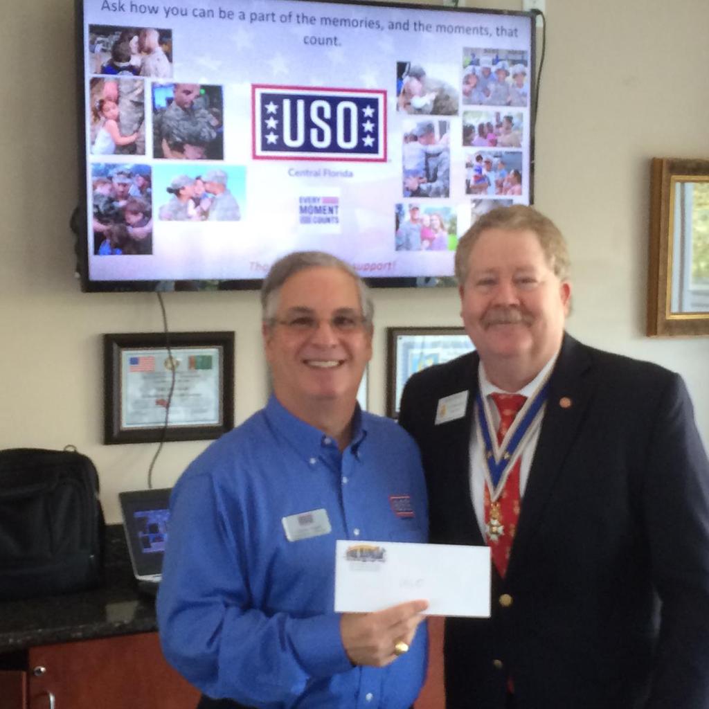 Central Florida USO s Chairman & CEO Charles Rogers receives