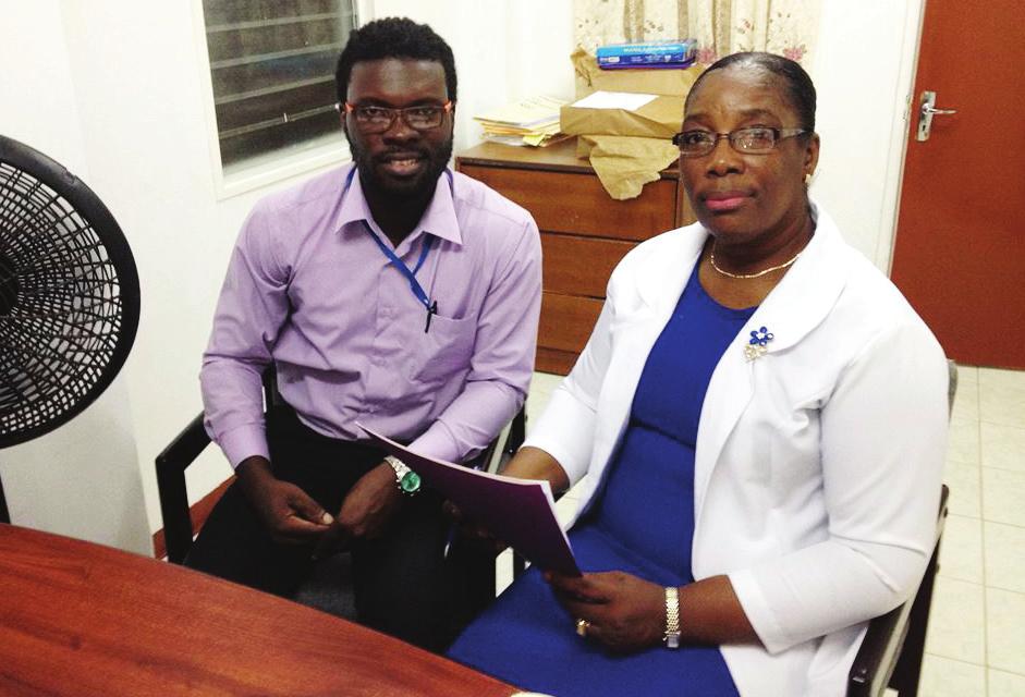 the Action in The caribbean REMITTANCES FLOWS AND PATTERN the Action s regional coordinator Jermaine grant reviews a technical Assistance Fiche together with carol lewis Primo Head of immigration and