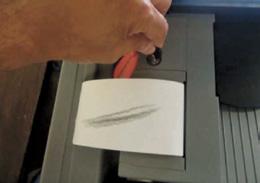 Get new paper roll from the side of the Scanner and scratch the
