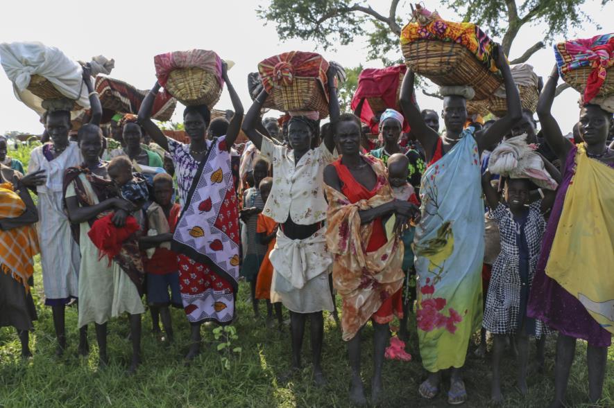 South Sudan on the brink Under a harsh sun, women stand with baskets on their heads, accompanied by sleeping or crying babies, waiting patiently for their food rations.