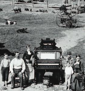 MOMENT in HISTORY HARD LIFE ON THE PLAINS English-born immigrant farmer David Hilton and his family proudly pose beside their pump organ on their homestead in Nebraska.