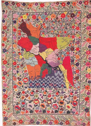 quilt itself, an embodiment of rebirth, of life despite death. Toward the colorful lotus at the center, linear forms point from each corner.