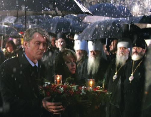 Figure 7-10 Ukraine President Viktor Yushchenko places a wreath during a memorial ceremony at the new Holodomor Memorial in Kiev in November 2008.