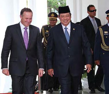 Clockwise from top: Petronas Twin Towers in Kuala Lumpur; Prime Minister John Key and Indonesian President Susilo Bambang Yudhoyono; Performer at the Southeast Asian night market in Wellington, 2013.