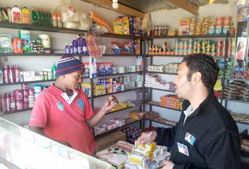 Interviewing an Ethiopian immigrant shop keeper. Price competition and jealousy have resulted in tensions and conflict between South African and foreign shop keepers. A Somali shop in Sweet Home Farm.