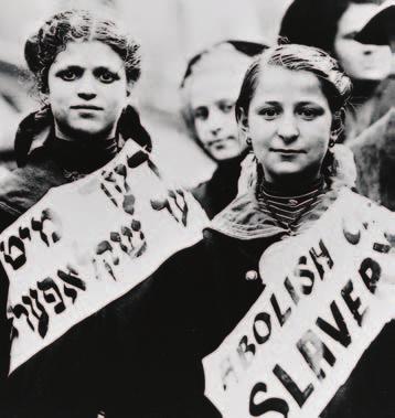 MOMENT in HISTORY YOUTHFUL PROTEST Two young immigrants march in a New York City demonstration against child labor practices in 1907.