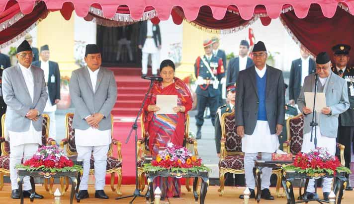 12 SRI LANKA/BANGLADESH/NEPAL Sri Lanka central bank keeps rates steady, says growth below potential Nepal s newly-elected Prime Minister KP Sharma Oli (right) is sworn in by President Bidhya