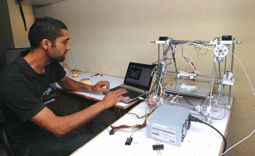 Suresh Ghimire works on a 3D printer. µ Chandra Shekhar Karki our client institutions will be amongst the first schools in the world training their students on using 3D printing technology.