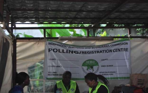 ABOVE: IEBC Officials carry out voter registration exercise for Kenyans.
