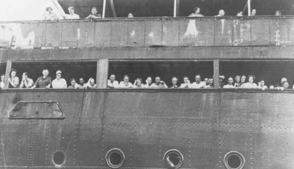 MAY 13, 1939 937 JEWISH REFUGEES FLEE NAZI GERMANY AND SAIL FOR HAVANA, CUBA Refugees aboard the "St. Louis" wait to hear whether Cuba will grant them entry.