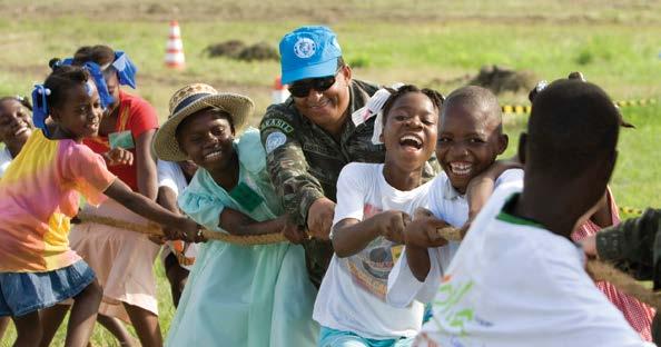 THE CAIRO CENTER CCCPA photo Vision & Mission Children play tug of war in MINUSTAH civic day event.