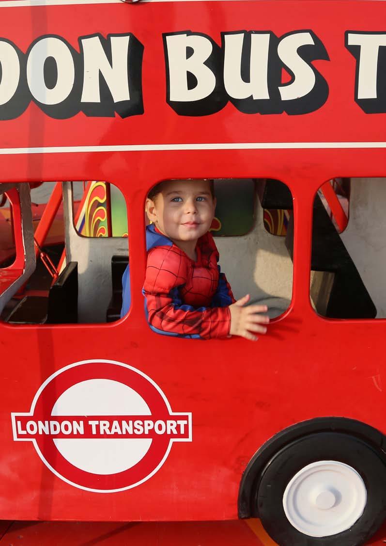 Syrian refugee Joud playing on a London bus on Brighton Pier.