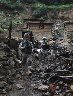 Soldiers from the 101st Airborne Division advance through the town of Barge Matal, Afghanistan, during an operation in July.