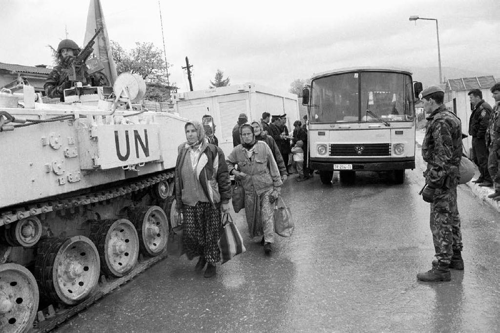 16 The United Nations: Challenges and Change UN Photo #907/John Isaac. In this photo from May 1994, UN soldiers monitor the movement of Bosnians at a UN checkpoint. to Bosnia.