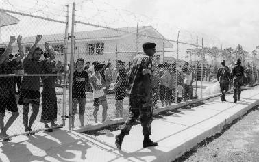 21 BAHAMAS Forgotten Detainees? Human Rights in Detention Soldiers patrol the inside of the Carmichael Detention Centre.