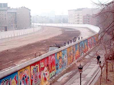 Beginning in November of 1989, the Berlin Wall is taken down by celebratory Germans from both the East