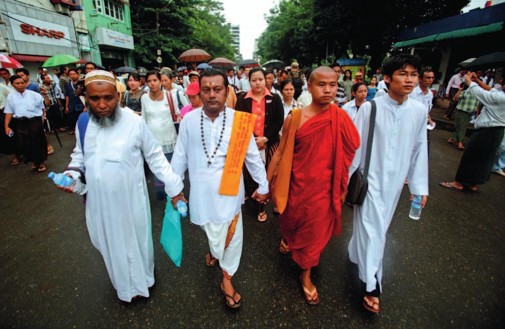 WIDENING THE DEMOCRATIC SPACE EPA/Lynn Bo Bo Leaders from four religions, Muslim, Hindu, Buddhist and Christian, march together in Yangon, Myanmar, to mark the 25th anniversary of the 8888 Uprising.
