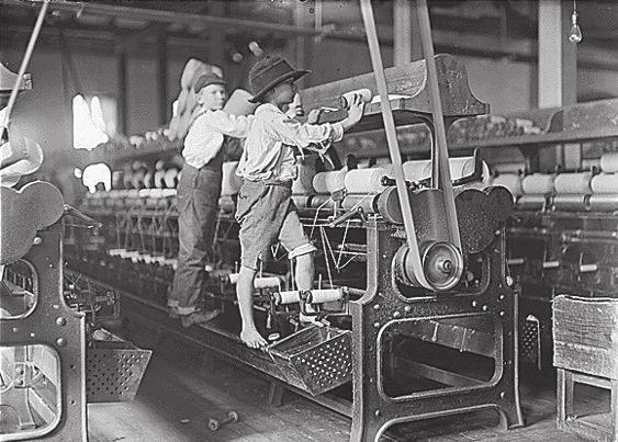 Document 4 Boys removing bobbins while machine is operating.