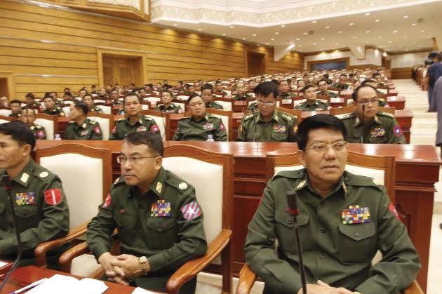 Section One Military MPs sitting in Union Parliament Copyright: The Irrawaddy Deeply fl awed and widely discredited elections followed in 2010 that put into power a quasi-civilian government under