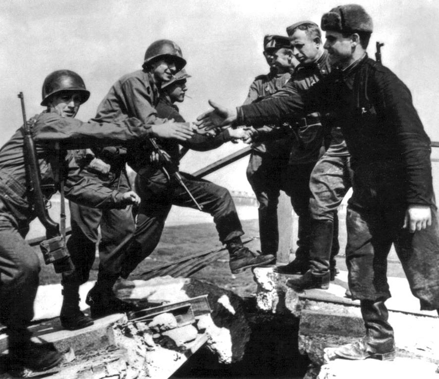 P L A C A R D A The Cold War Begins American and Russian soldiers meet across a bridge on the Elbe River in
