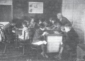 Fig.15 Children at school in Soviet Russia in the 1930s. They are studying the Soviet economy. Fig.16 A child in Magnitogorsk during the First Five Year Plan. He is working for Soviet Russia. Fig.17 Factory dining hall in the 1930s.