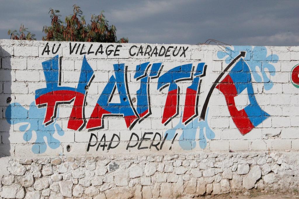 36 15 MINUTES TO LEAVE Mural reading In Carradeux Village, Haiti lives on!