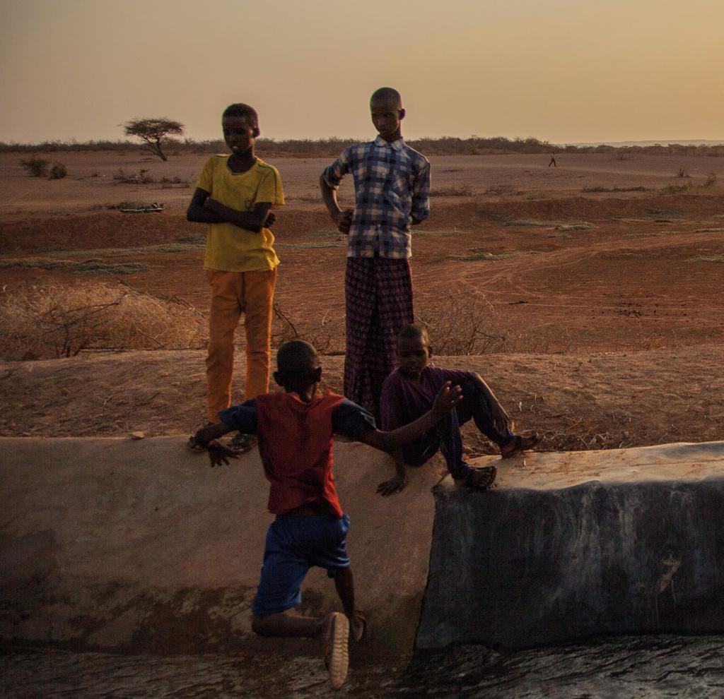 CONCLUSION Children play next to the water of the irrigation scheme at Hilaweyn camp in southern Ethiopia.