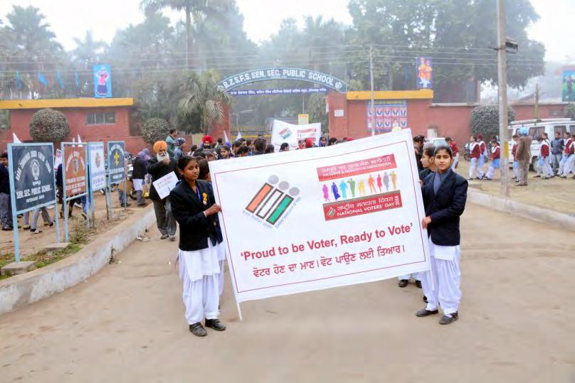 Students showing a banner bearing slogan 'Proud to be Voter,