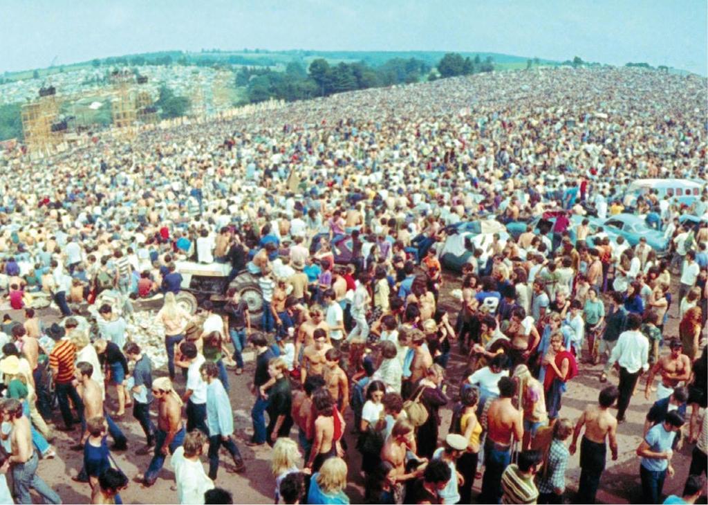 The Woodstock music festival drew nearly half a million people to a farm in