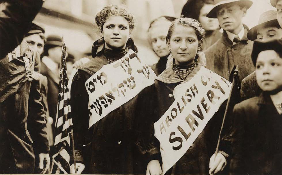 Document 20 Polish immigrants in 1908 with signs demanding an end to unfair child labor practices that affected Poles and other