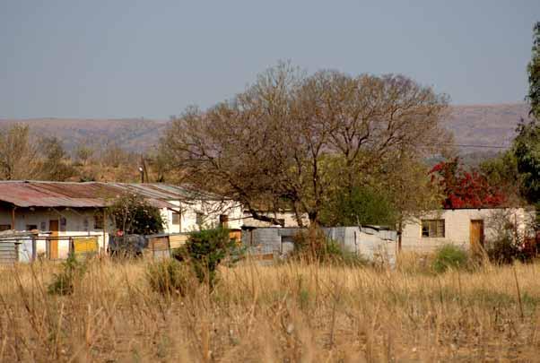 RELOCATION OF THE MMADITLHOkOA COMMUNITY BY THARISA MINERALS (PTY) LTD. In 2008 the Tharisa Minerals mining company demolished the shacks of farm labourers living in the Spruitfontein area.