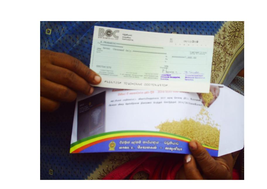 travelling allowances to those who were transported to election meetings and rallies. The lady in the above photograph was given a cheque for Rs.