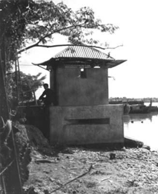 HUNDREDS OF BLOCKHOUSE STRONG POINTS WERE BUILT TO PROTECT THE PEASANTS FROM THE VC (Vietcong).