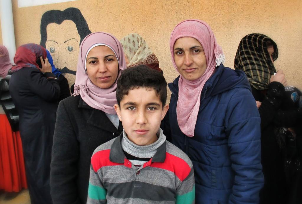These sisters and one of their sons arrived from Syria recently. They registered for temporary protected status but still could not access services, so they are now asking a local NGO for help.